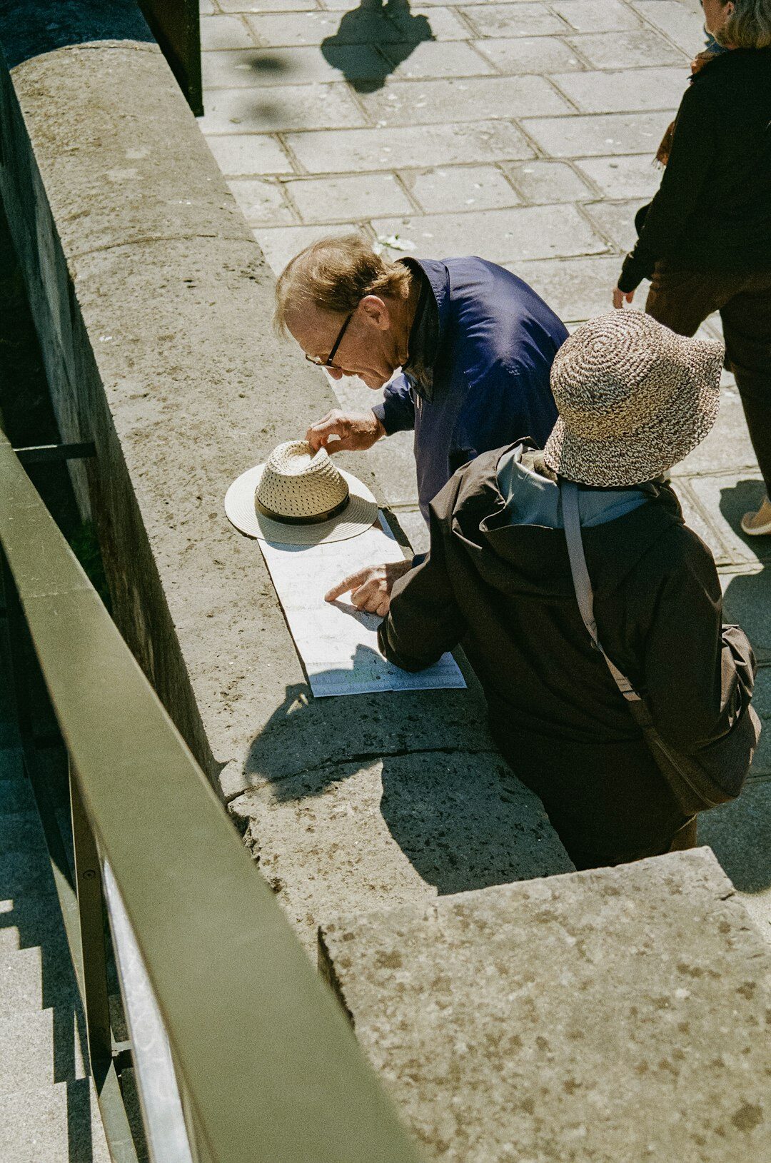 elderly people discussing documents