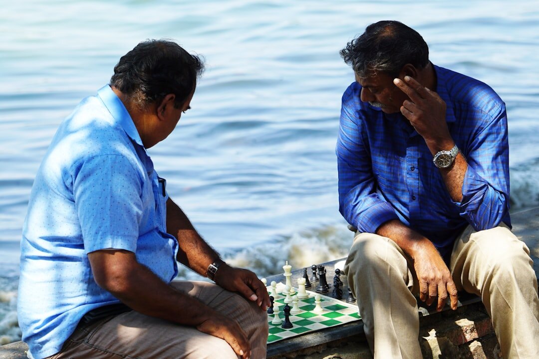 senior man playing chess
