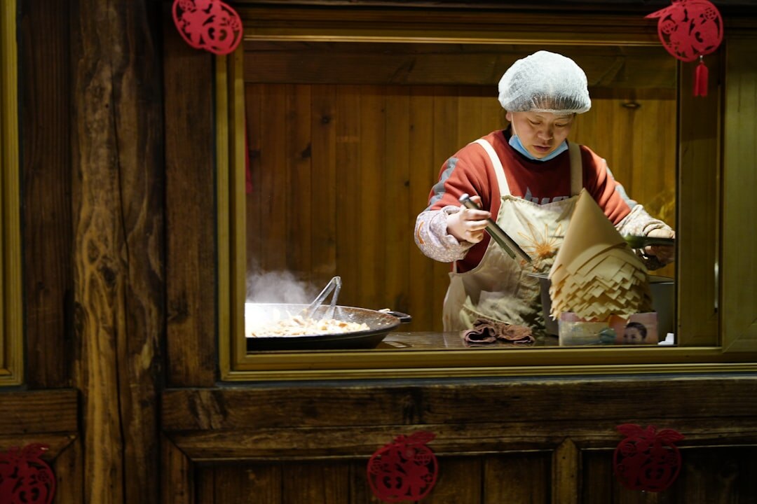 elderly woman baking cookies