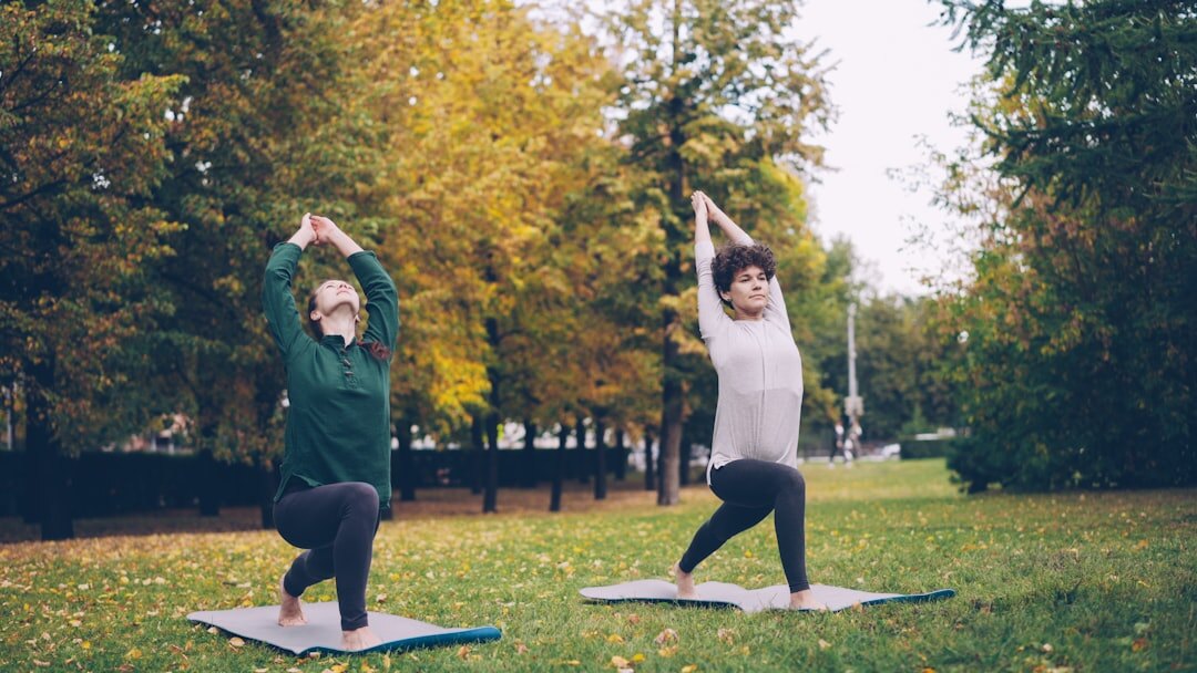 seniors doing yoga outdoors
